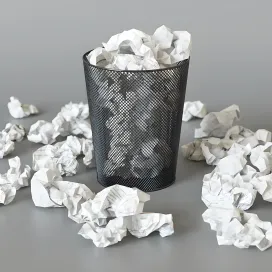 A trash can with papers